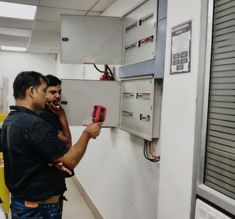 Engineer conducting electrical inspection at a facility
